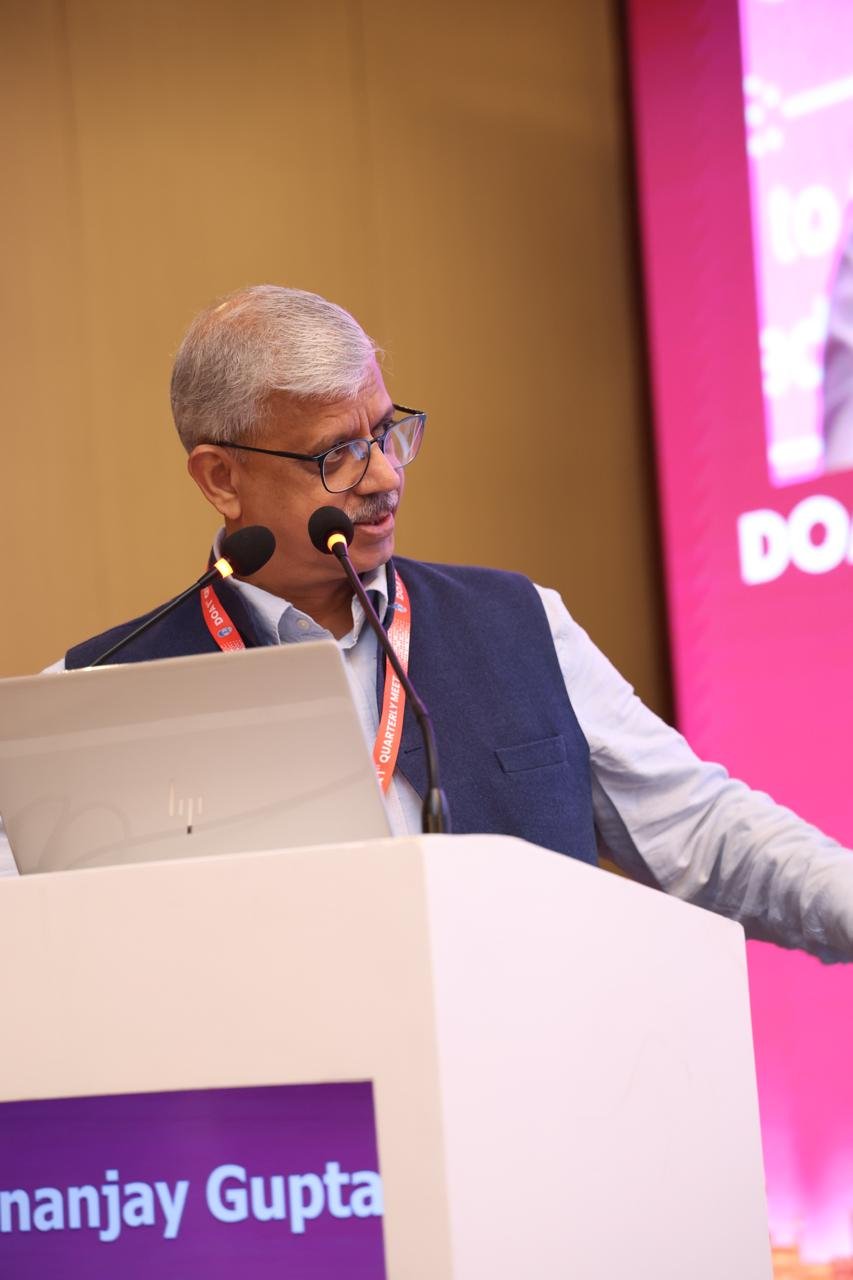 Dr. Dhananjay Gupta at the speaker podium during DOA 1st Quarterly Meet 2026