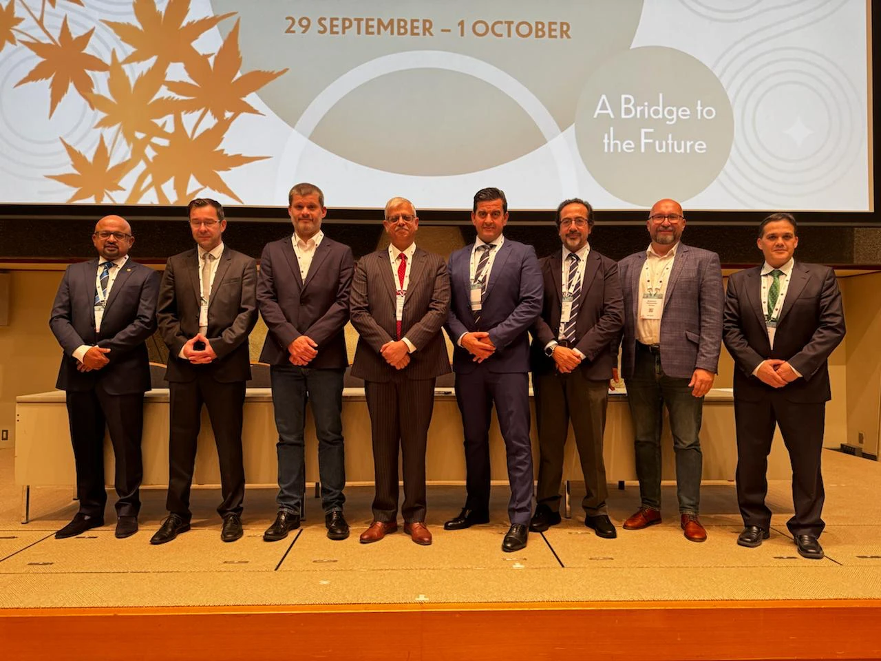 Session faculty on stage at SICOT 2026 Kyoto under the congress theme "A Bridge to the Future"